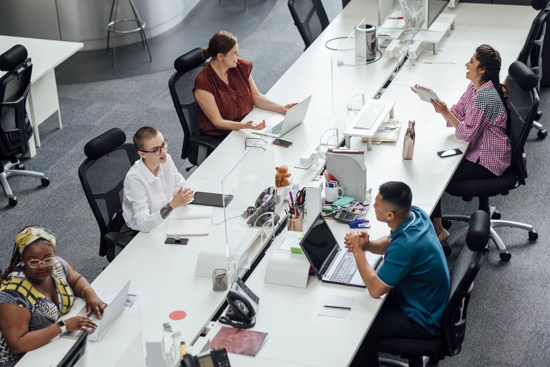 Team discussing work in a modern office