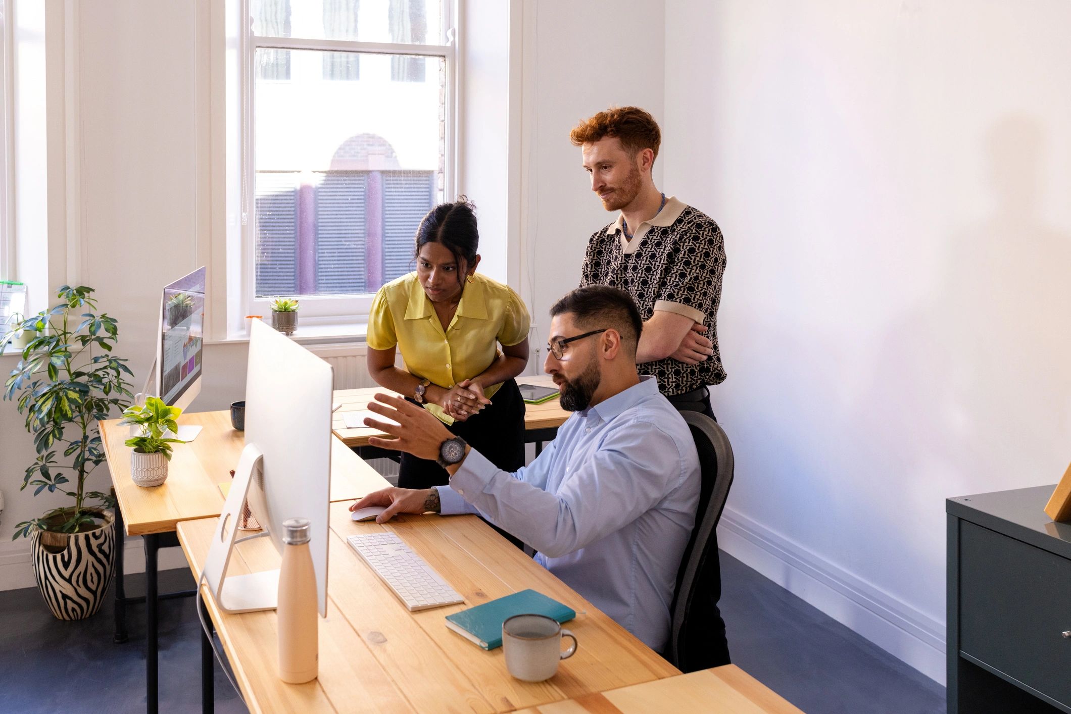 E-commerce team reviewing store strategy in a modern workspace