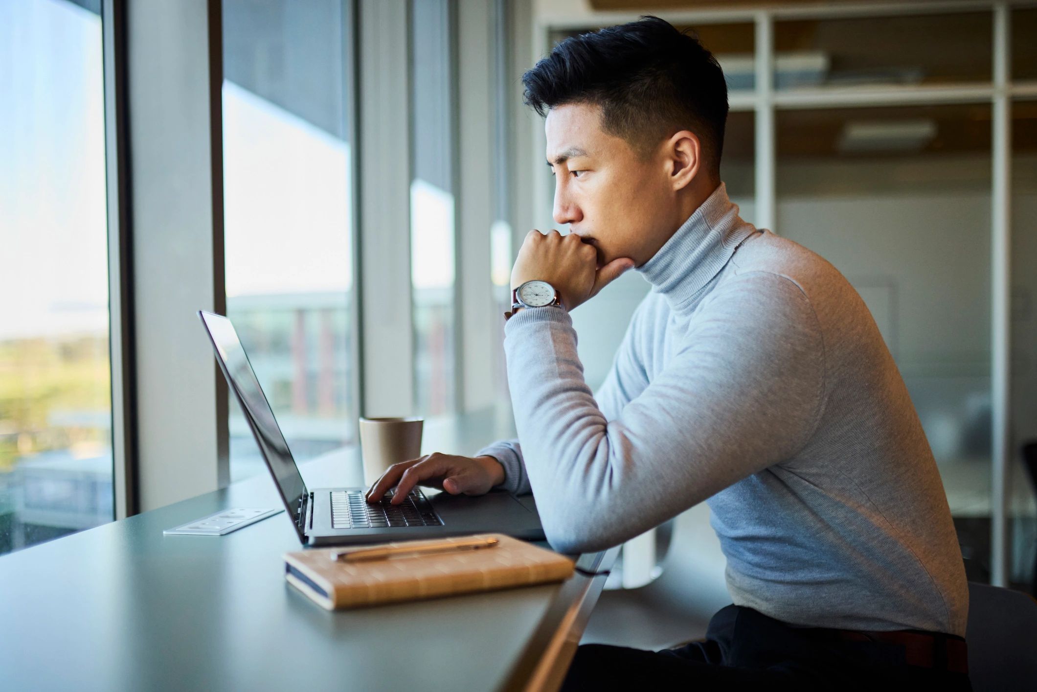 Professional working on ecommerce listings from a laptop