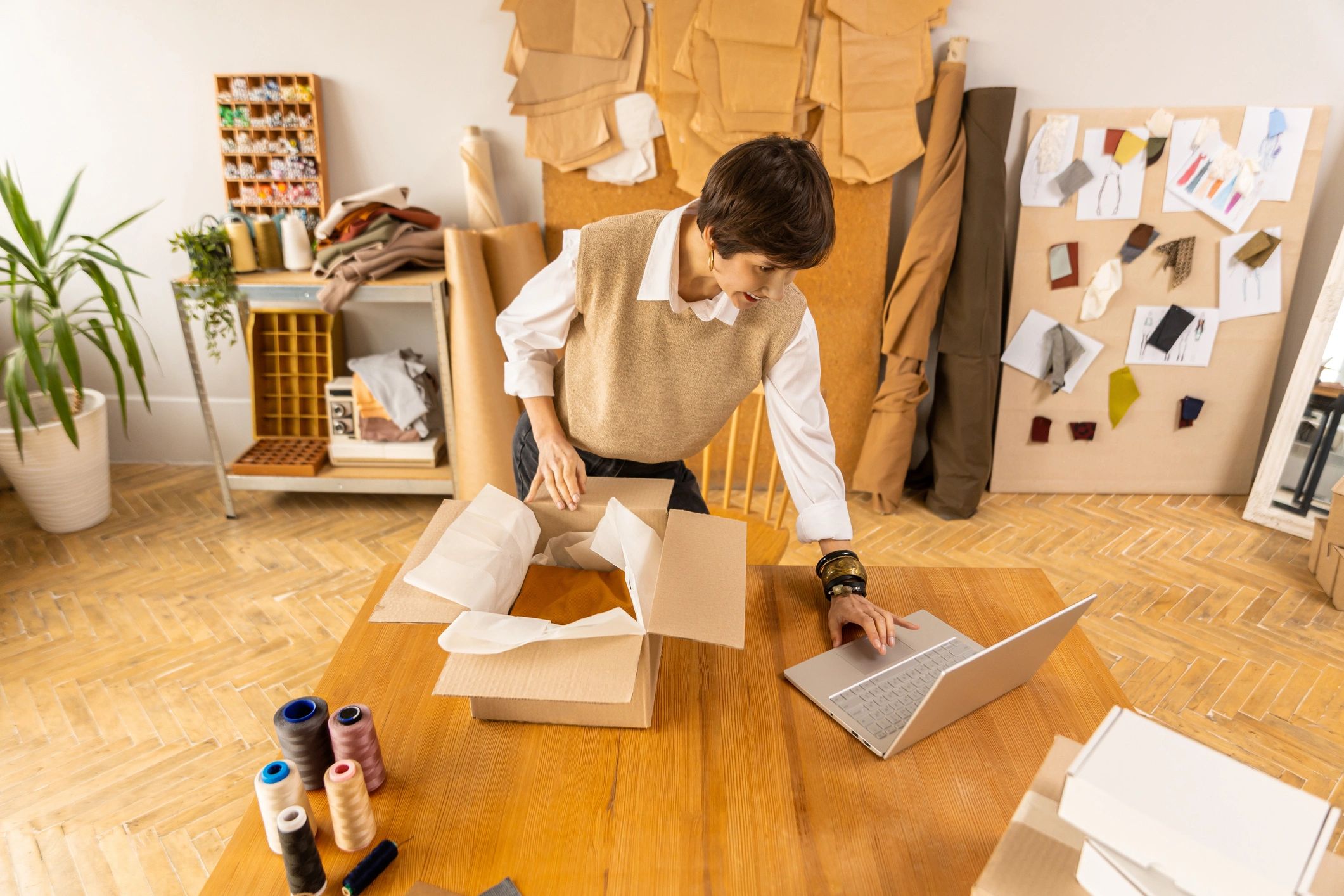 Online seller workspace with laptop and shipping boxes
